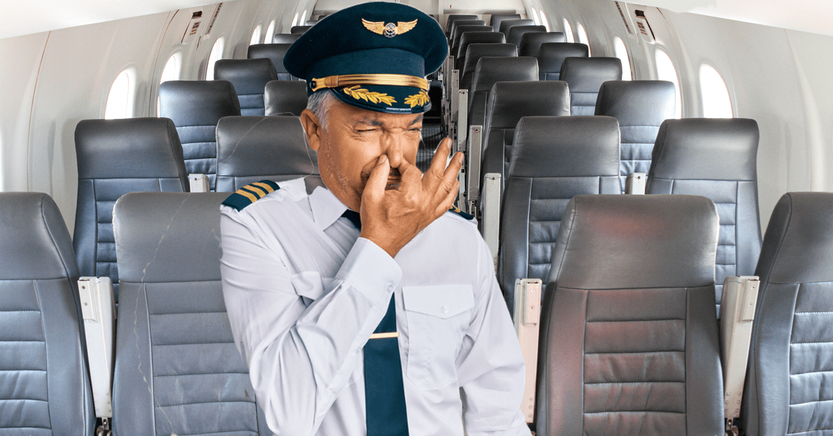 Ein Kapitän im Flugzeug hält sich wegen Gestank die Nase.